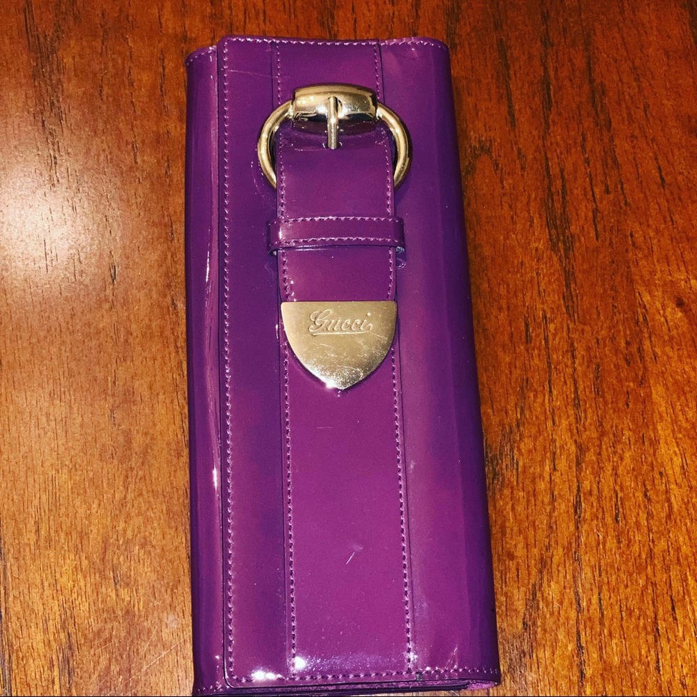 Purple Gucci clutch.